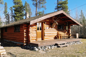 A larger cabin with a deck in front.