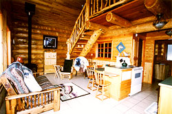 Living dining area with stairs to loft