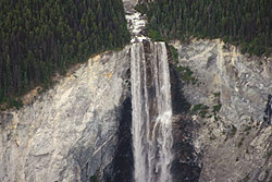 Photo courtesy of Debra Austin. Water rushes over a cliff from a lake.