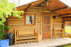 Cabin three face and deck with a screen door