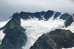 Photo courtesy of Debra Austin. A bowl at the top of a mountain has been carved out by the glacier that still fills it.