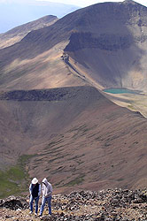 Photo courtesy of Miriam Schilling. Two women hike back from a mountain.