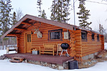 A larger cabin with a deck in front.