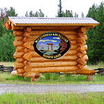 Wilderness Rim Log sign at road.